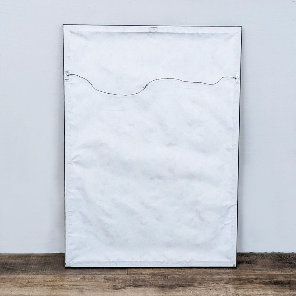 Back of the framed print showing a wire for hanging.