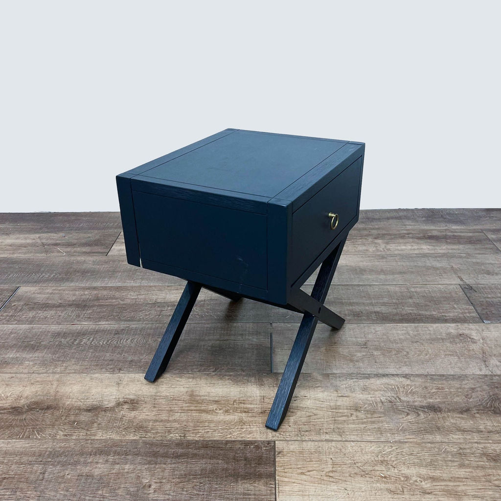 Reperch End Table featuring sleek blue design and X-shaped base.