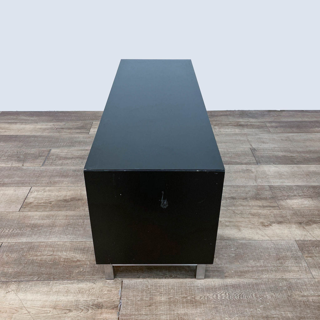 the coffee table is made from a black steel structure.