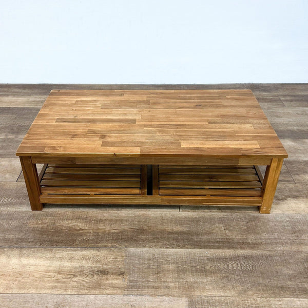 Wooden coffee table with a slatted shelf, featuring a smooth oak finish.