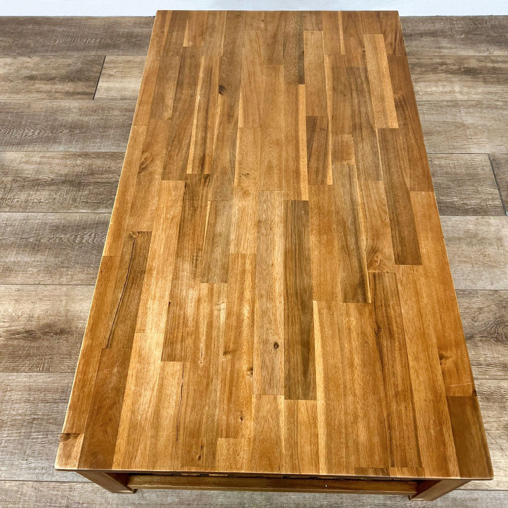 Top view of a rectangular, oak-finished wooden coffee table.