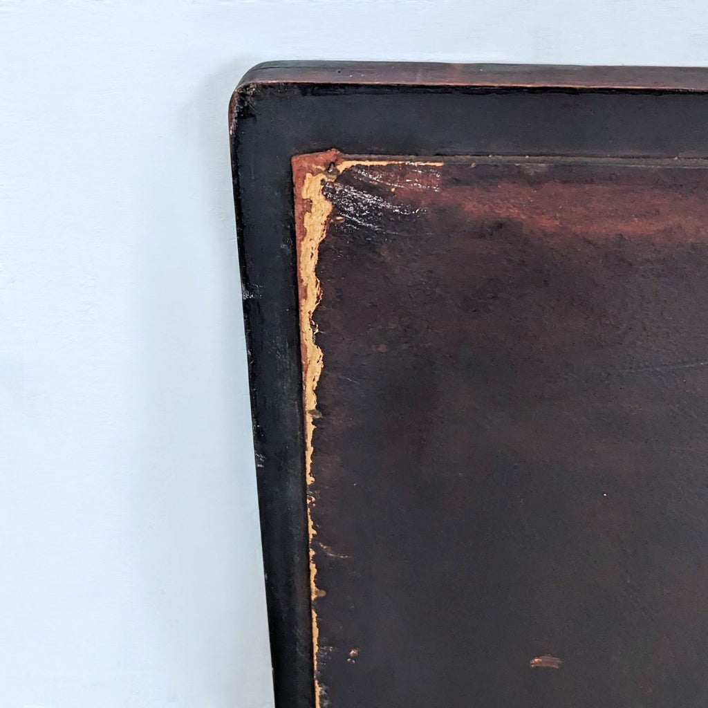Close-up of the wood frame detailing on a Reperch mirror.