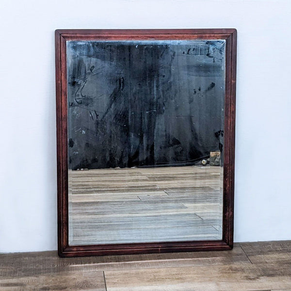 Traditional wall mirror with rounded wood frame by Reperch.