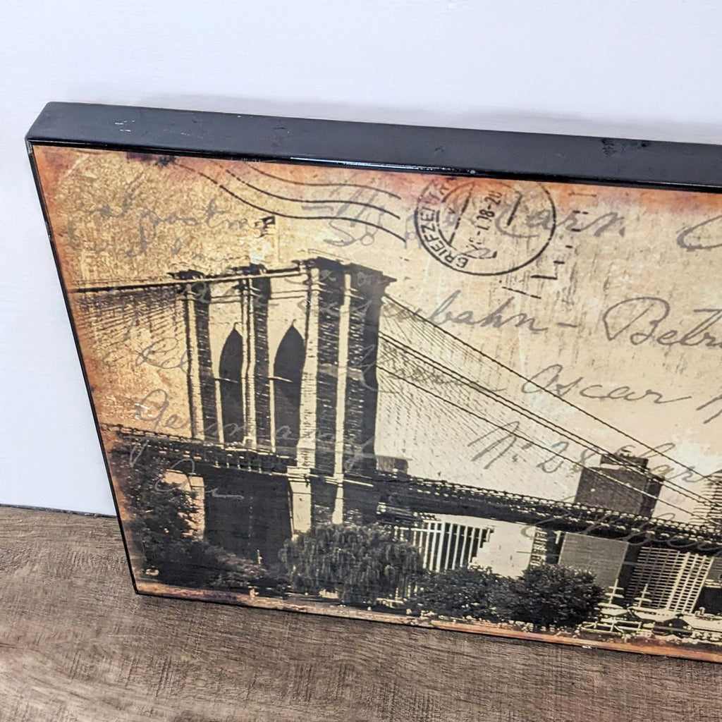 2. Close-up of the Brooklyn Bridge art print with vintage postcard elements and wood mounting.