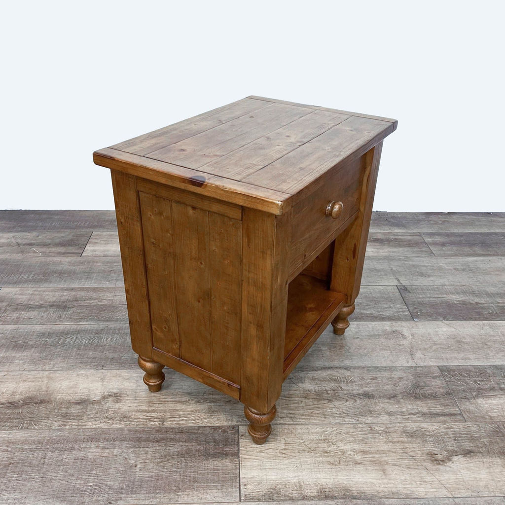 Side view of Pottery Barn pine end table, showcasing rustic design and shelf.