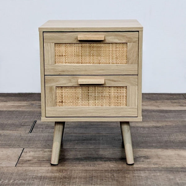 Reperch end table with rattan drawer fronts and angled legs.