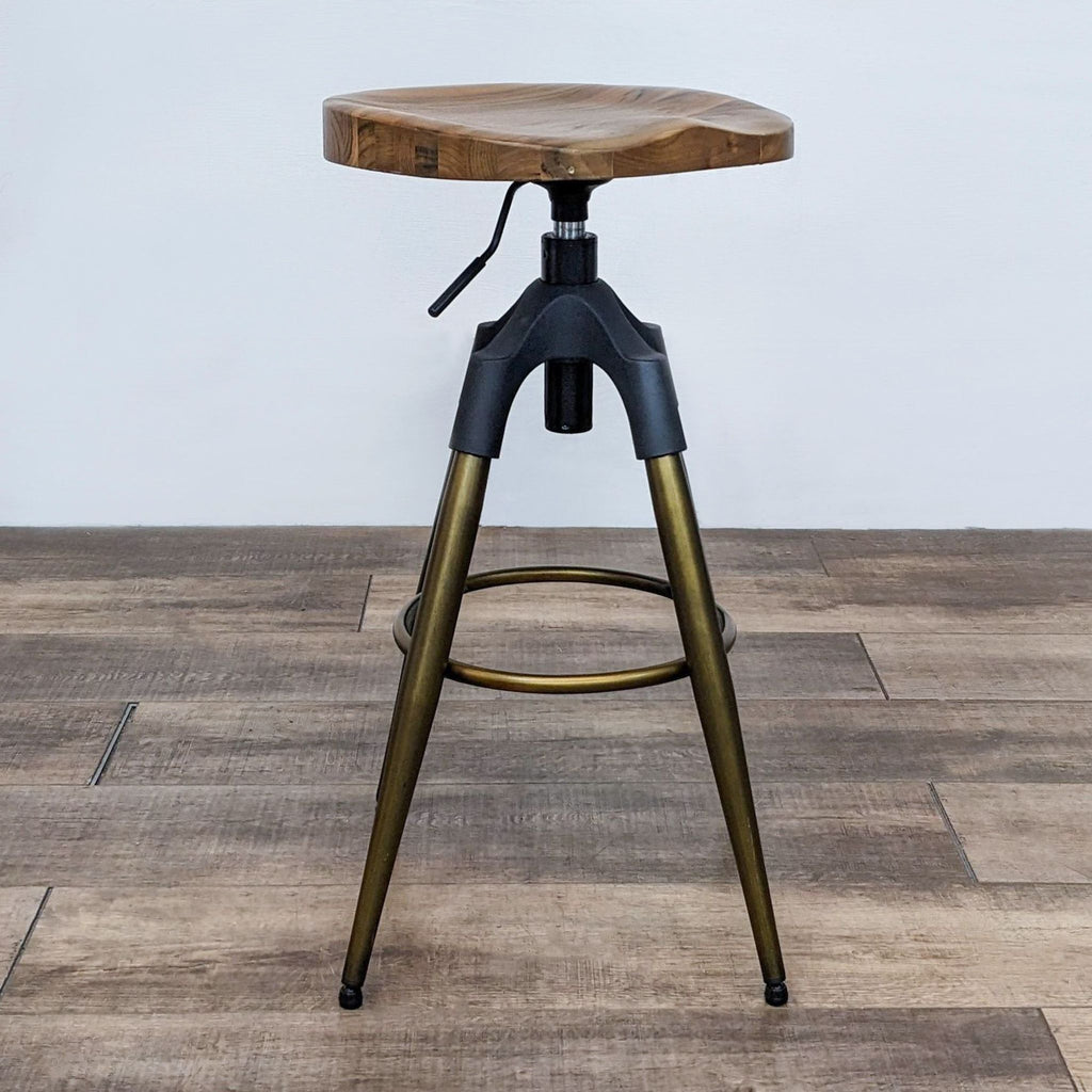 Solid wood stool with natural grain, black and gold frame, adjustable height.  