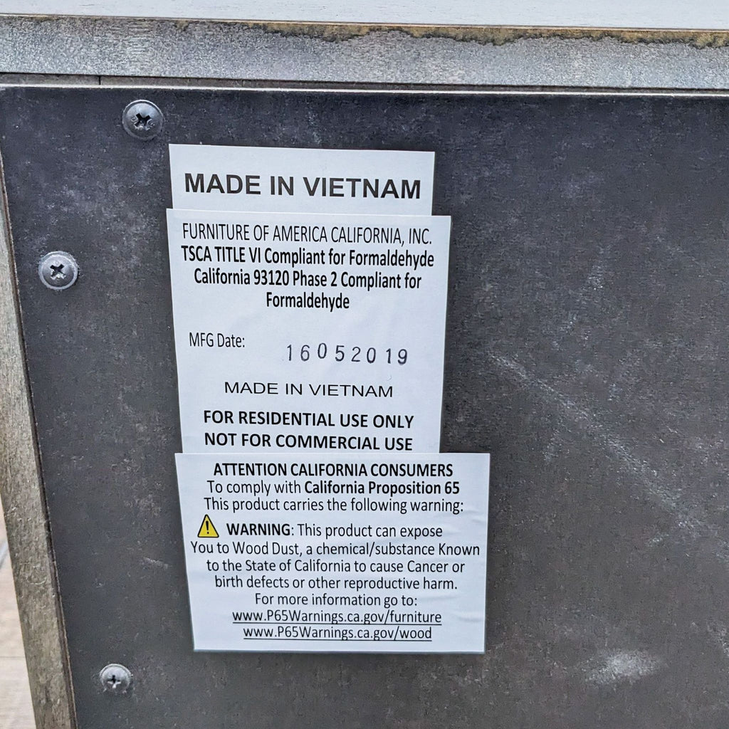 Label on end table indicating it's made by Furniture Of America in Vietnam.