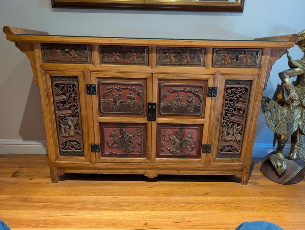 Antique Chinese wedding bed panels repurposed as a sideboard from circa 1999, showcased with ornate woodwork.