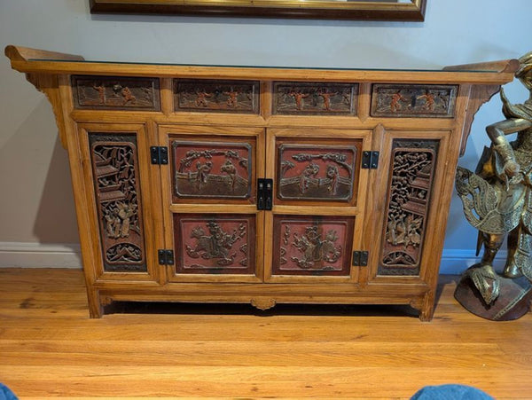 Antique Chinese wedding bed panels repurposed as a sideboard from circa 1999, showcased with ornate woodwork.