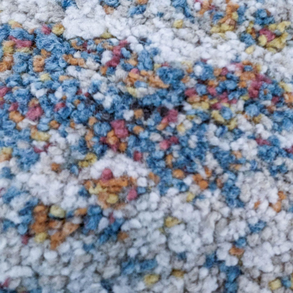 Close-up of the Granada Ezra Rug's plush Olefin heatset frise yarns in mixed colors.