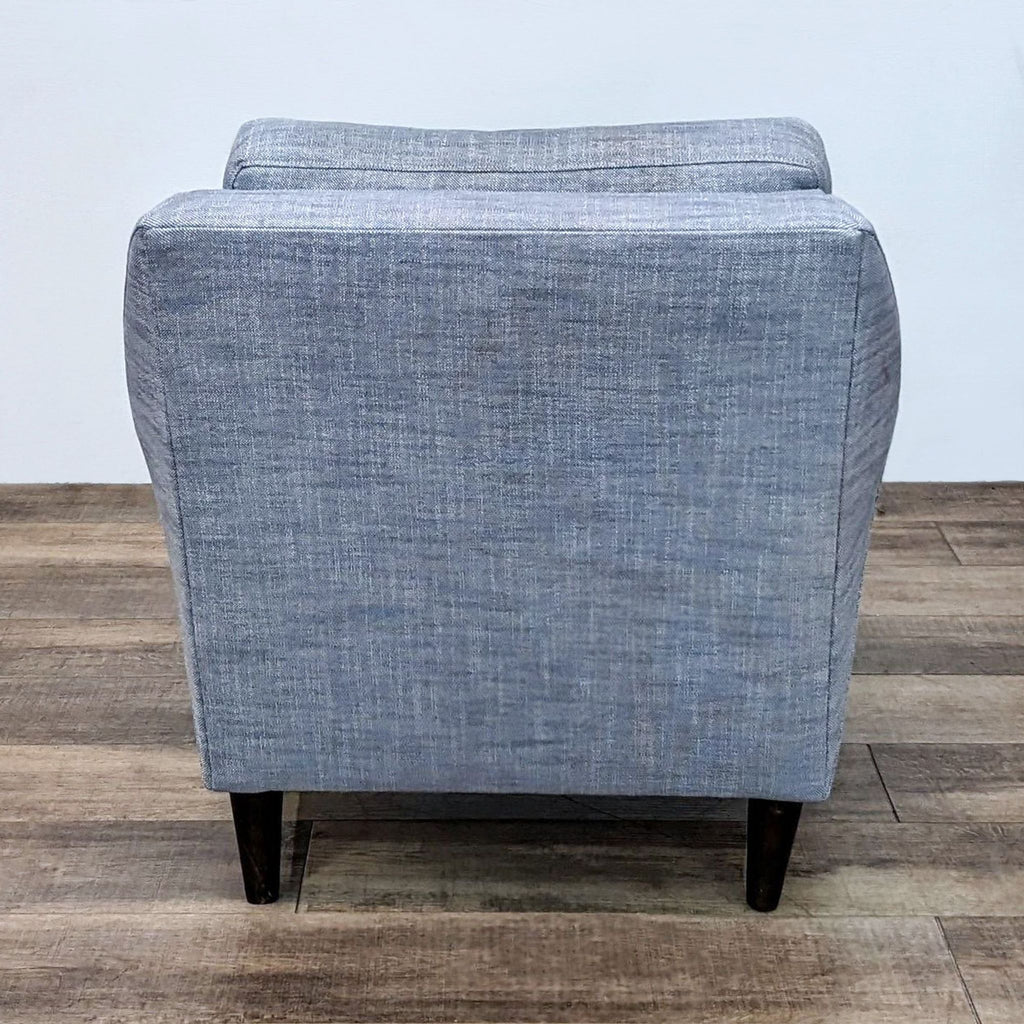 Back view of the low-slung Everett Chair by West Elm.