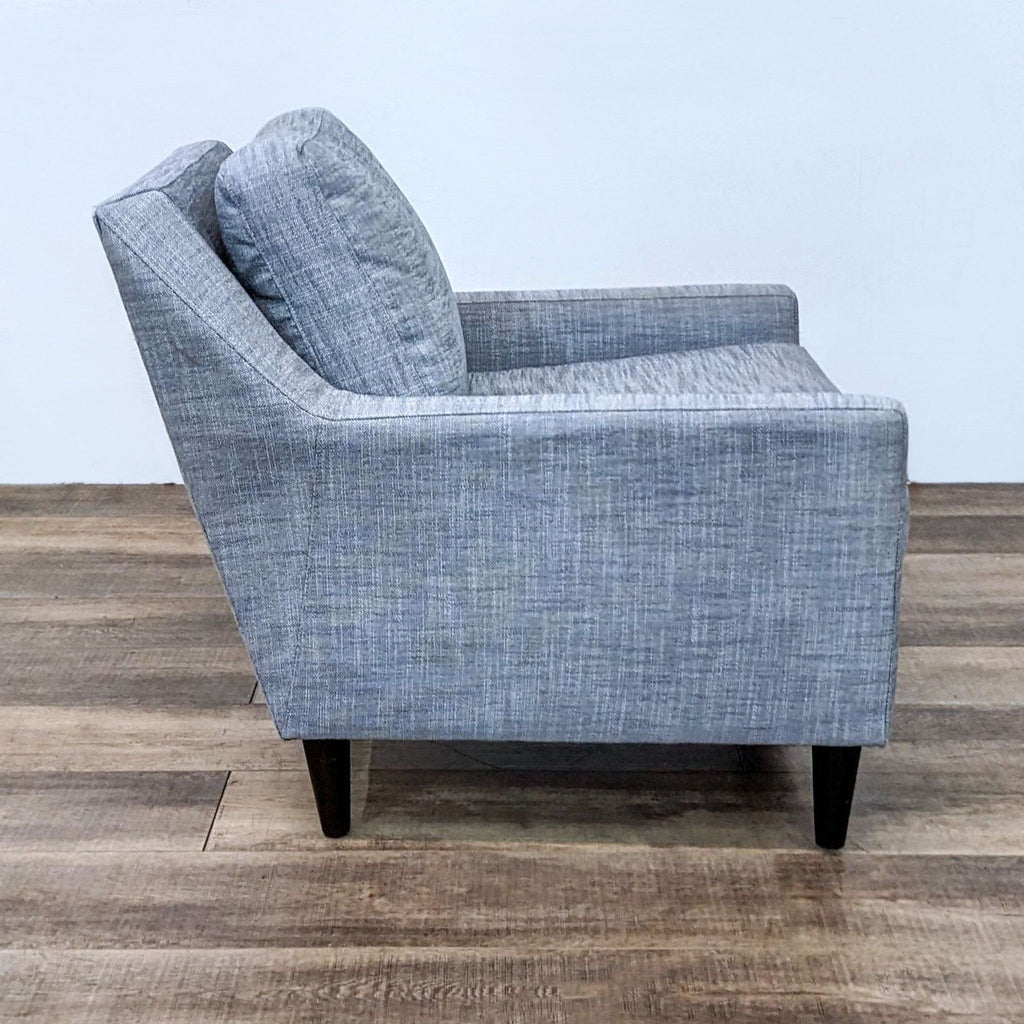 Side view of the compact Everett Chair in Shelter Blue fabric.