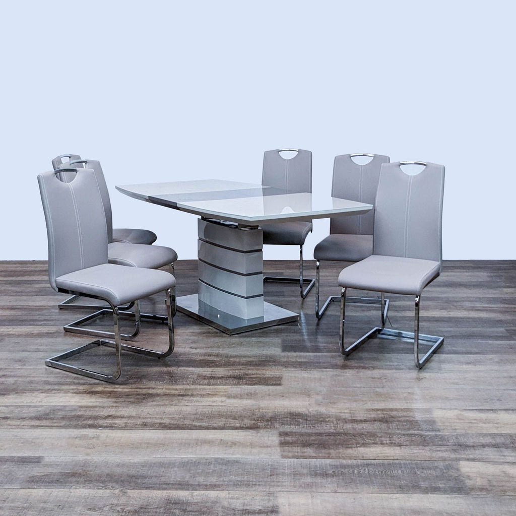 Modern dining set with glossy white and gray-taupe finish, chrome accents, and faux leather chairs.