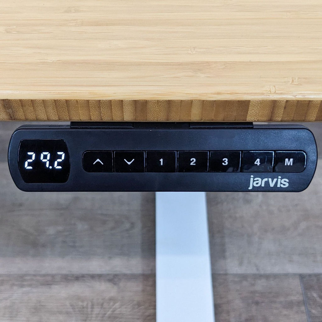 Close-up of Jarvis desk control panel showing height of 29.2 with adjustment buttons.