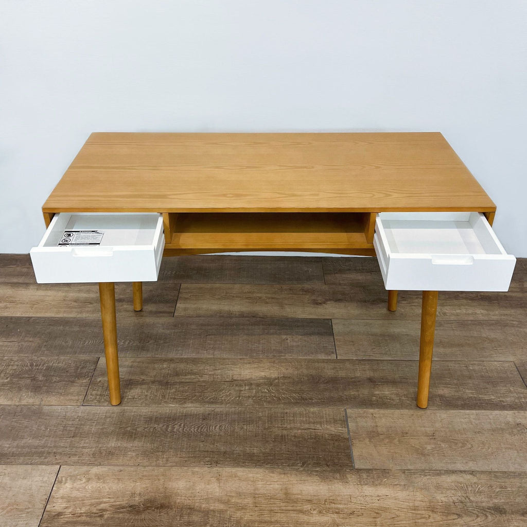 Wooden desk with open storage and two white drawers by Reperch; tapered legs enhance design.