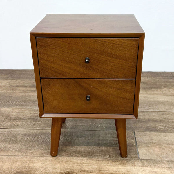 Reperch wooden end table with two drawers and sleek legs.