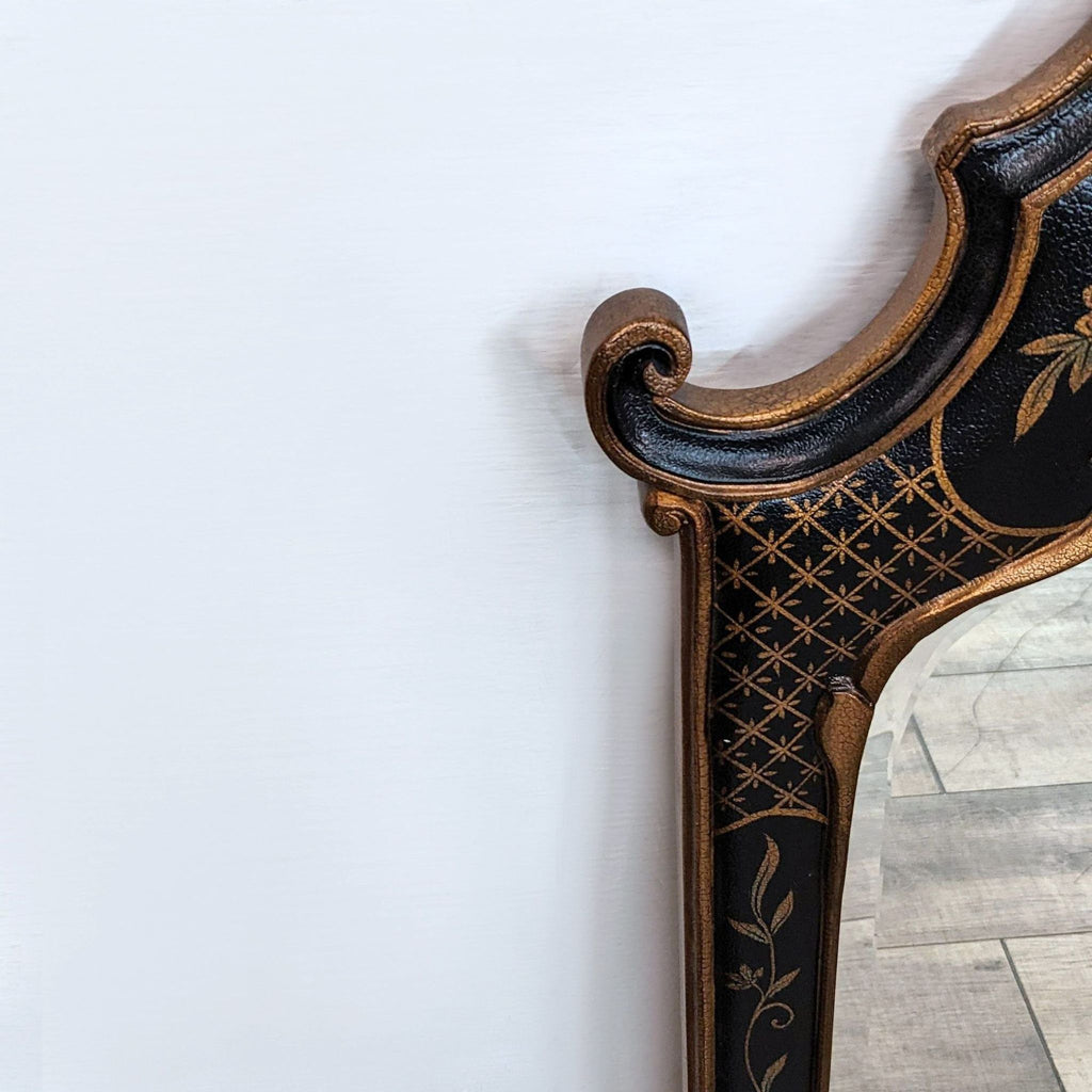 Close-up of Ethan Allen mirror frame with intricate Rococo-style gilt details.