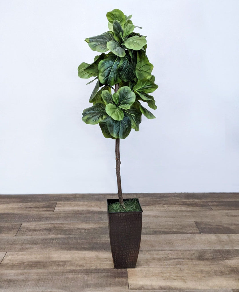Full view of artificial Fiddle Leaf Fig tree in a tall black planter.