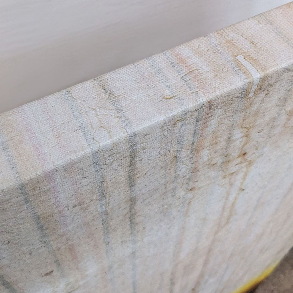 Close-up of the canvas edge showing textured detail.