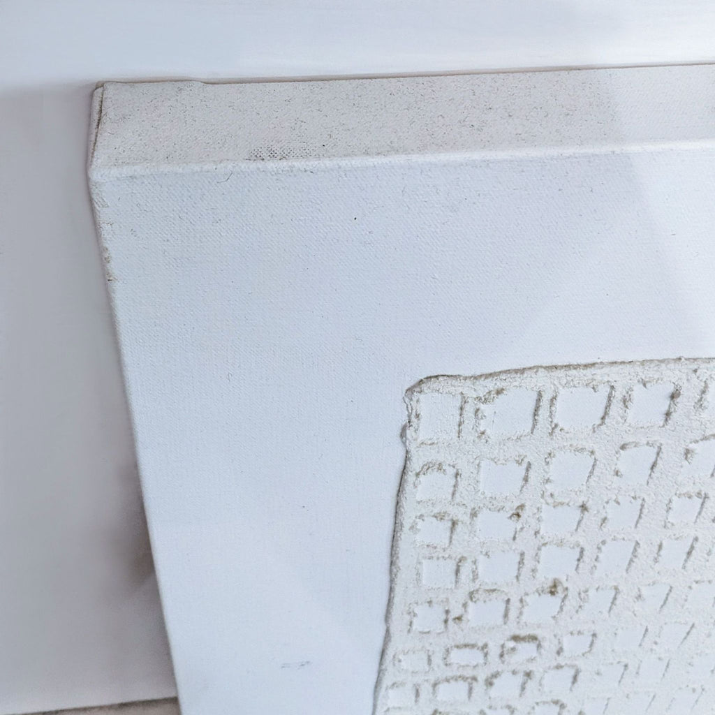 "Canvas edge with textured square pattern from 'Mono Vestige IV'."