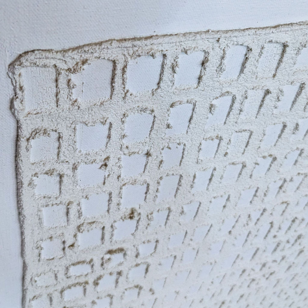 "Detailed view of textured pattern on canvas with square shapes."