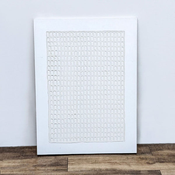 "Textured canvas with arranged small squares, part of 'Mono Vestige IV'."