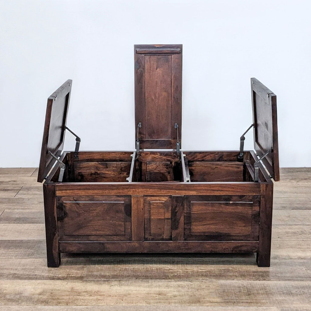 Reperch coffee table with open lift-top compartments, showing interior storage.  