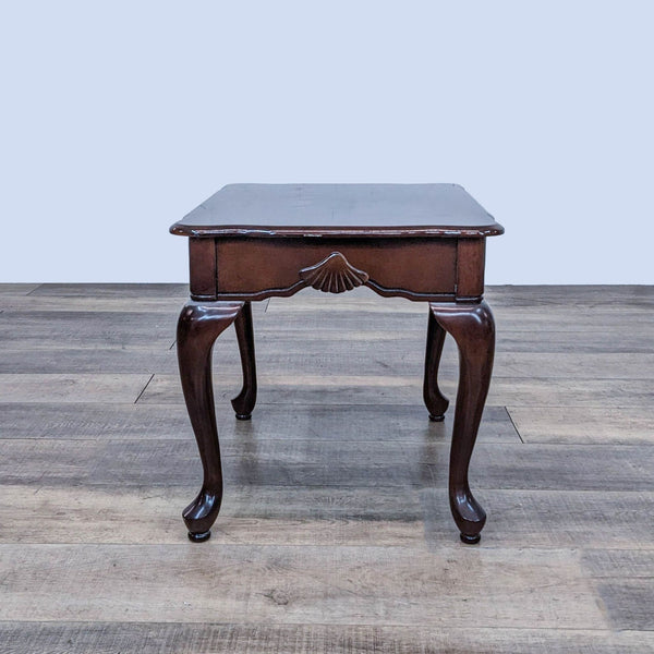 Reperch end table with cabriole legs and scallop shell carving.