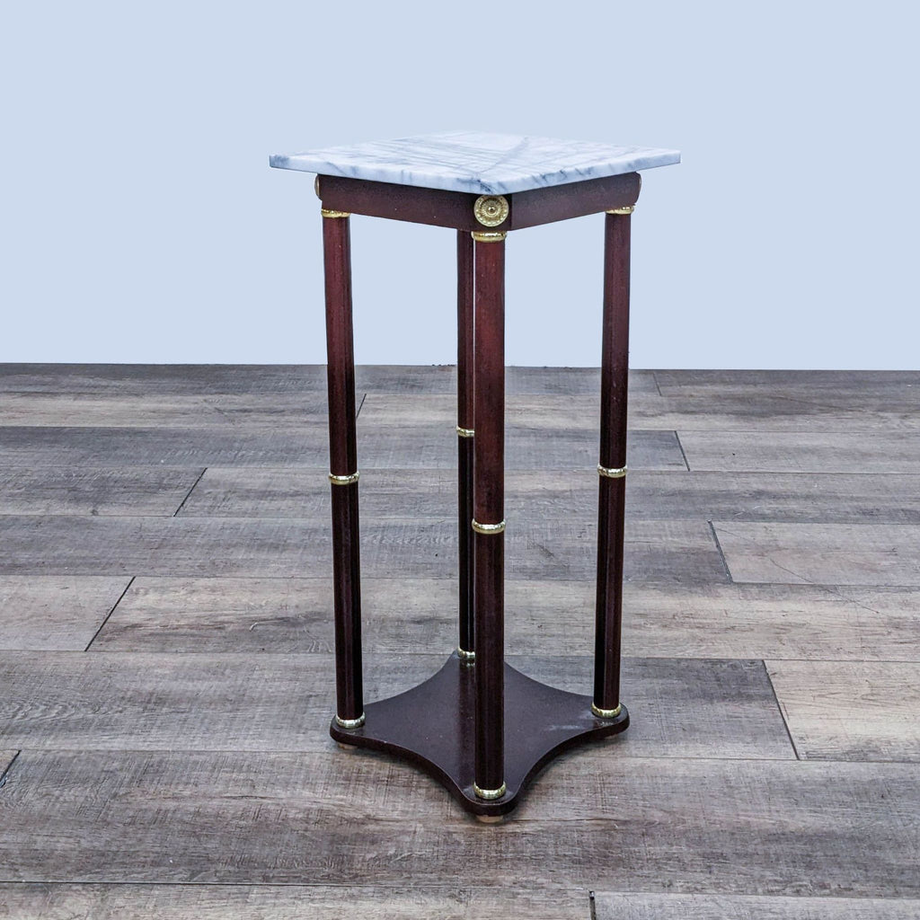 Reperch wooden end table with marble top, featuring decorative brass accents.