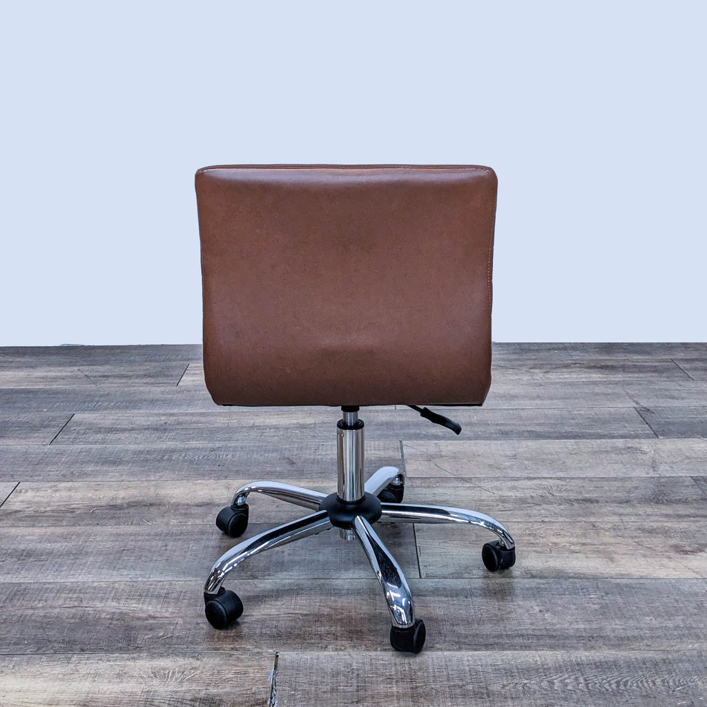 Back view of a brown task chair with adjustable height and caster wheels.
