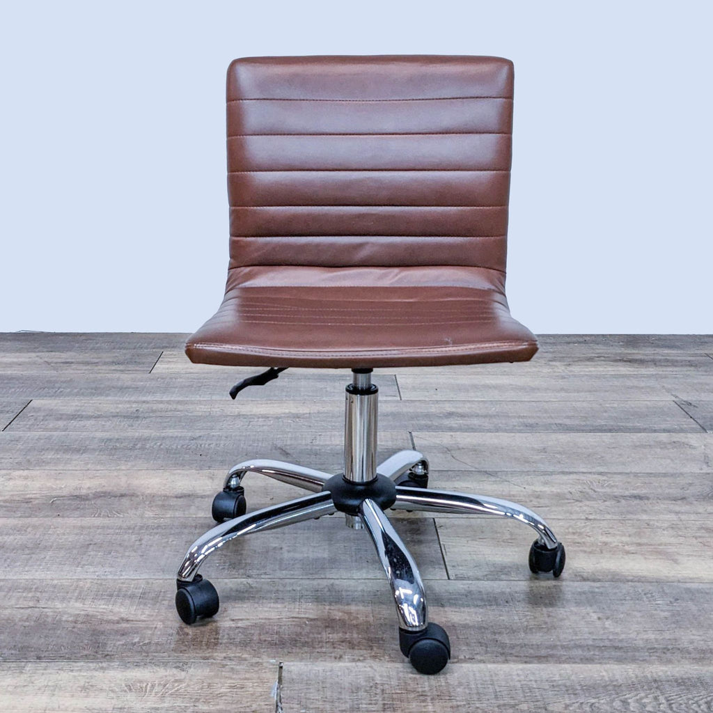 Front view of a brown faux leather office chair with swivel base and wheels.