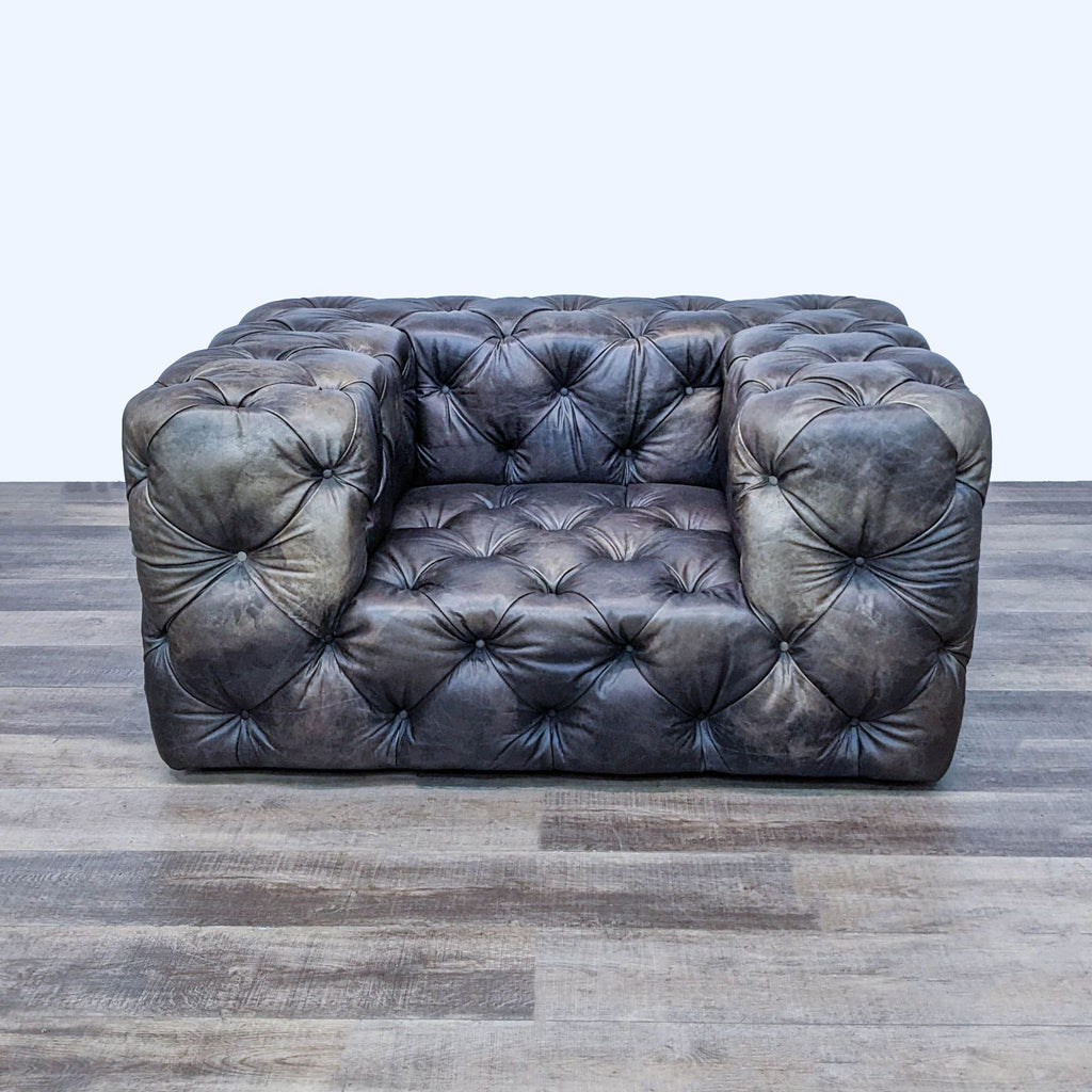 1. Front view of the SoHo club chair by Restoration Hardware, featuring plush button-tufted dark leather.