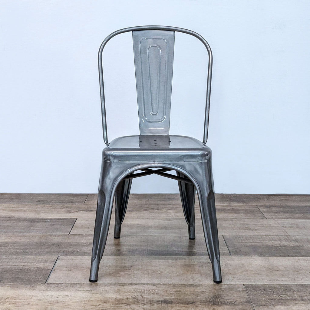 Reperch Dining Chair: Sturdy metal with tall, curved back and tapered legs. Indoor/outdoor use.