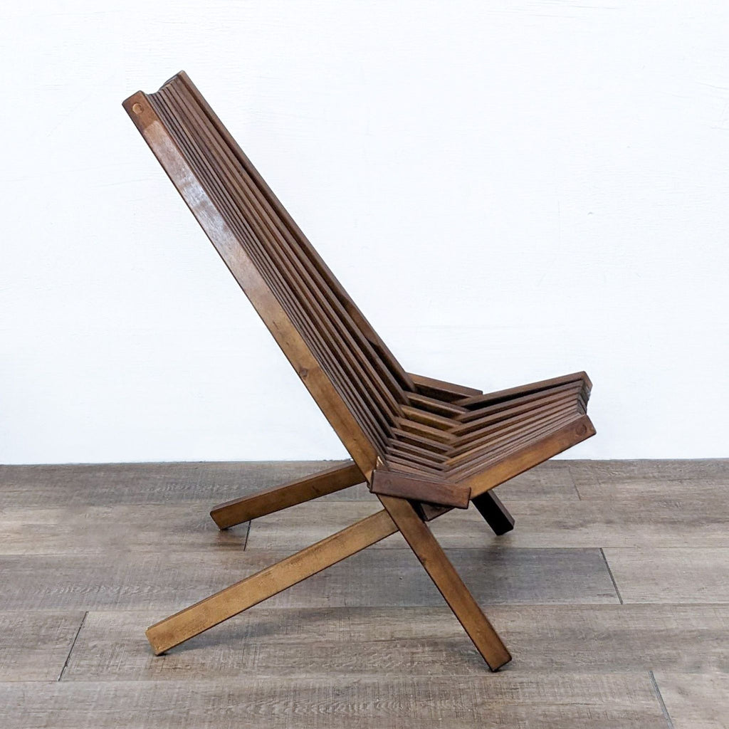 Front view of modern teak chair by Reperch with vertical slats.