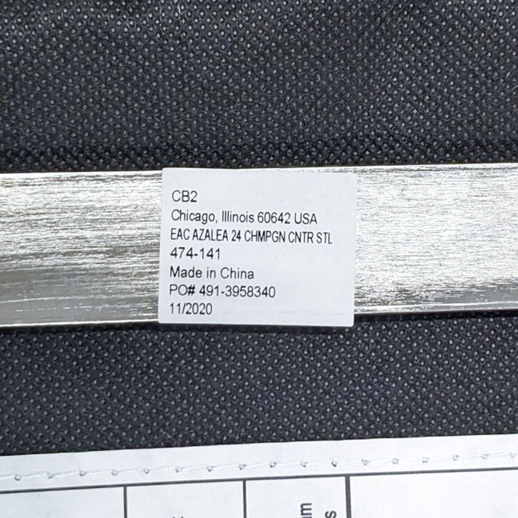 a metal strip with a label on it.