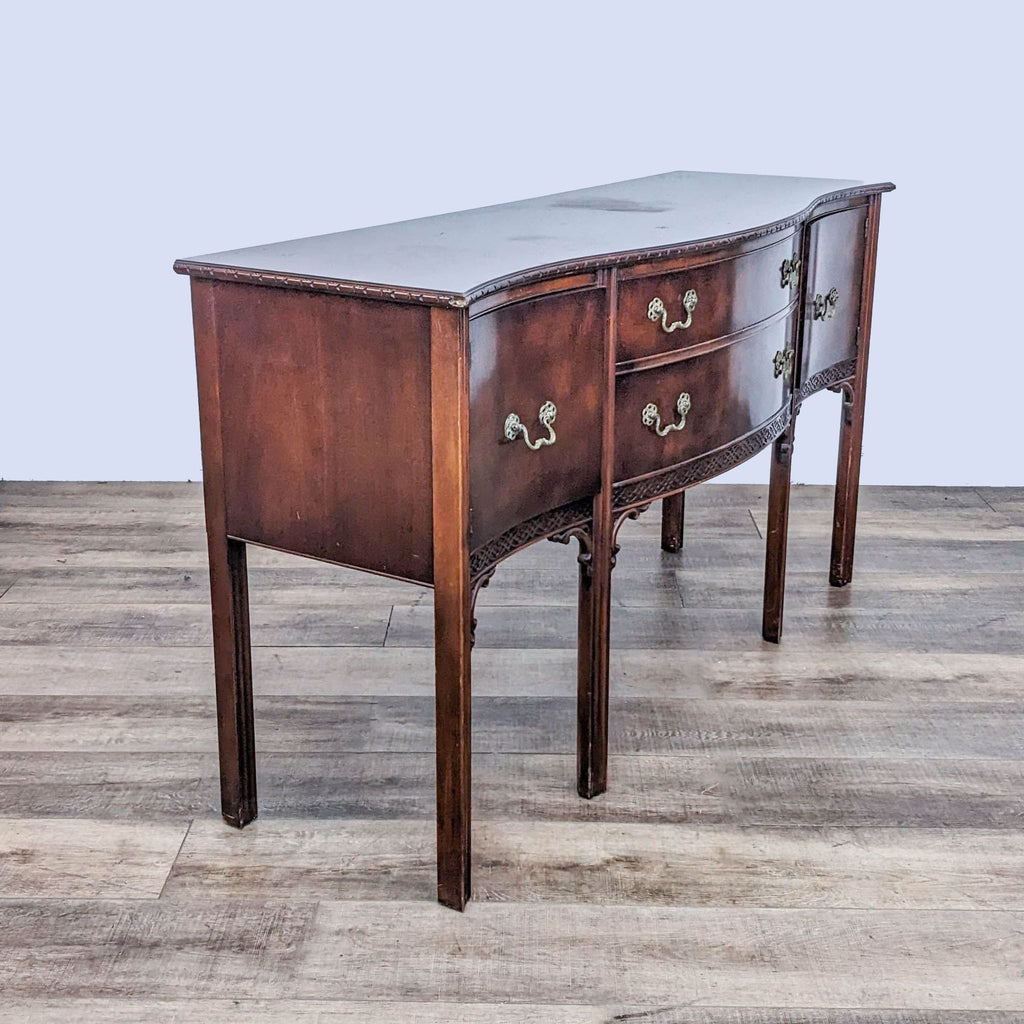 Side view of a wooden sideboard showing intricate detailing and sturdy legs. 