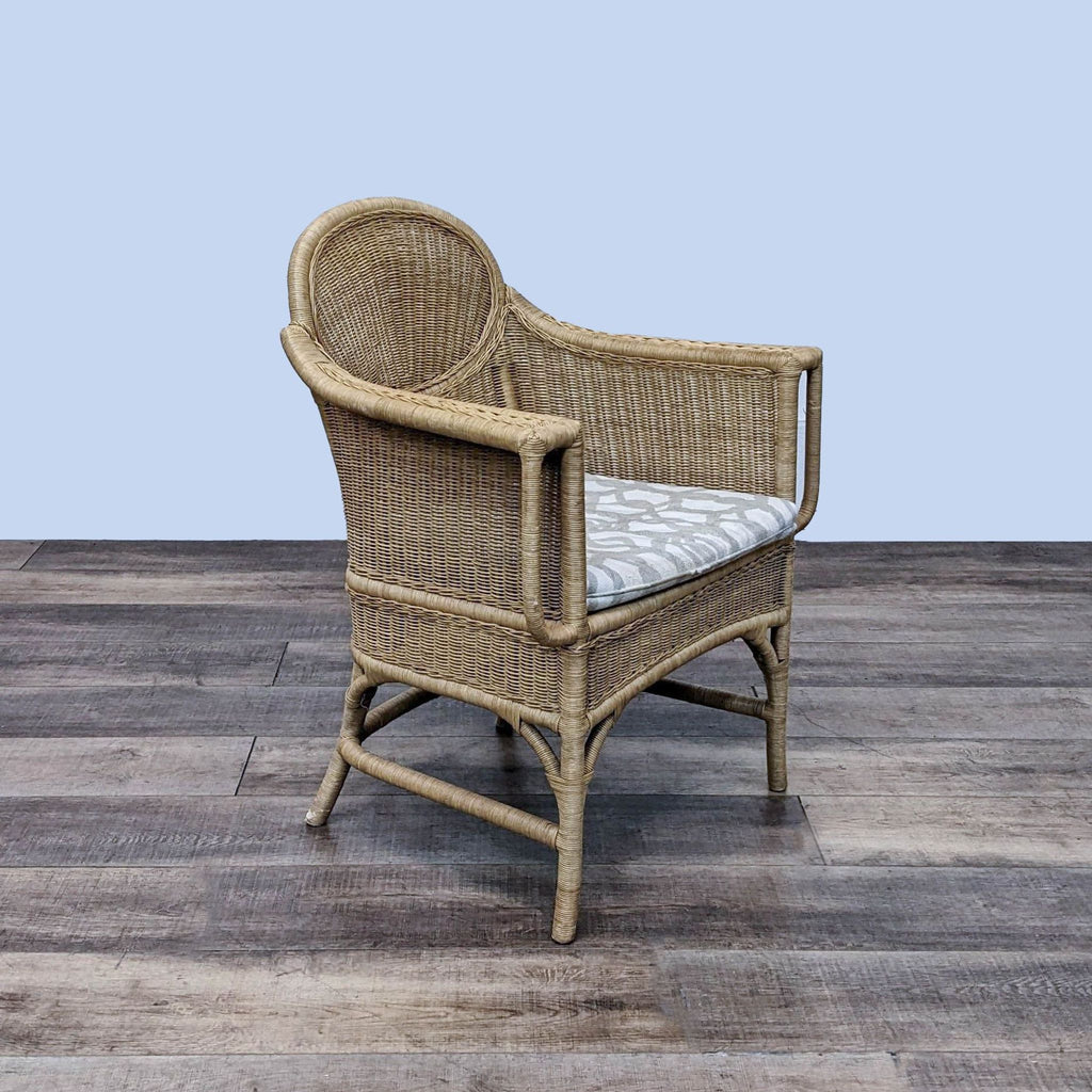 Angled view of a wicker rattan armchair, highlighting its design.