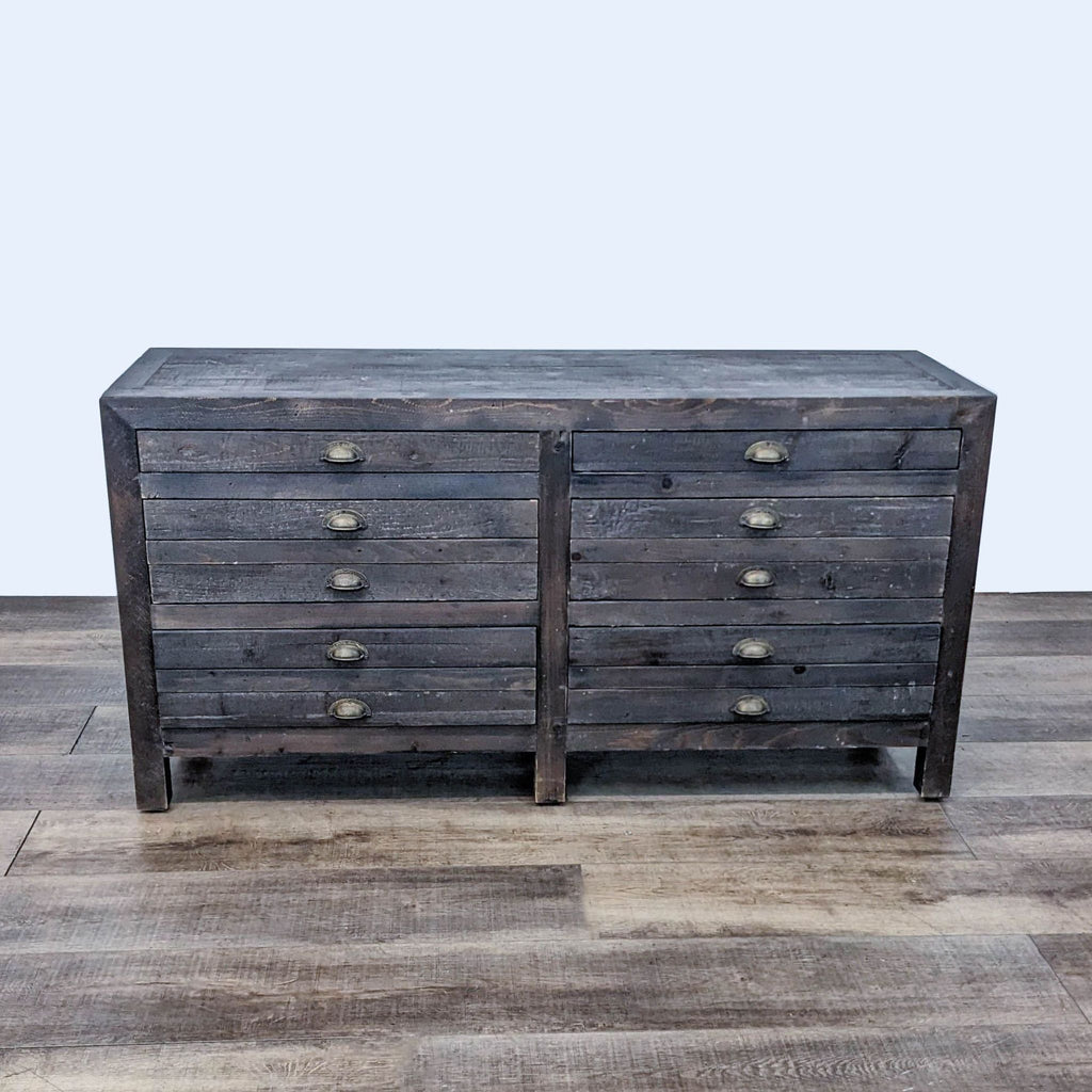 Front view of The Printmaker's Sideboard, a distressed pine dresser with multiple drawers.  