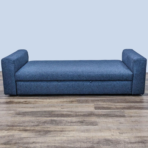 Contemporary blue daybed with trundle pulls out to form a queen-size bed.