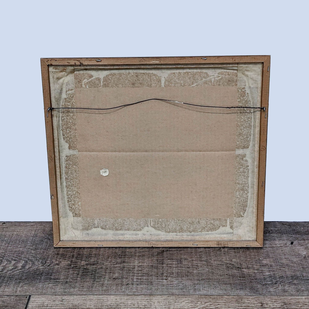 Back view of framed art print with wire for hanging.