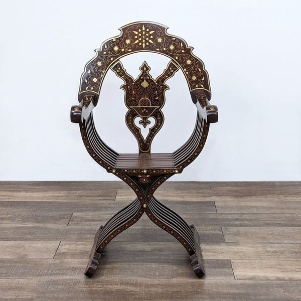 Savonarola chair with brass inlay detailing, foldable and ornate design.