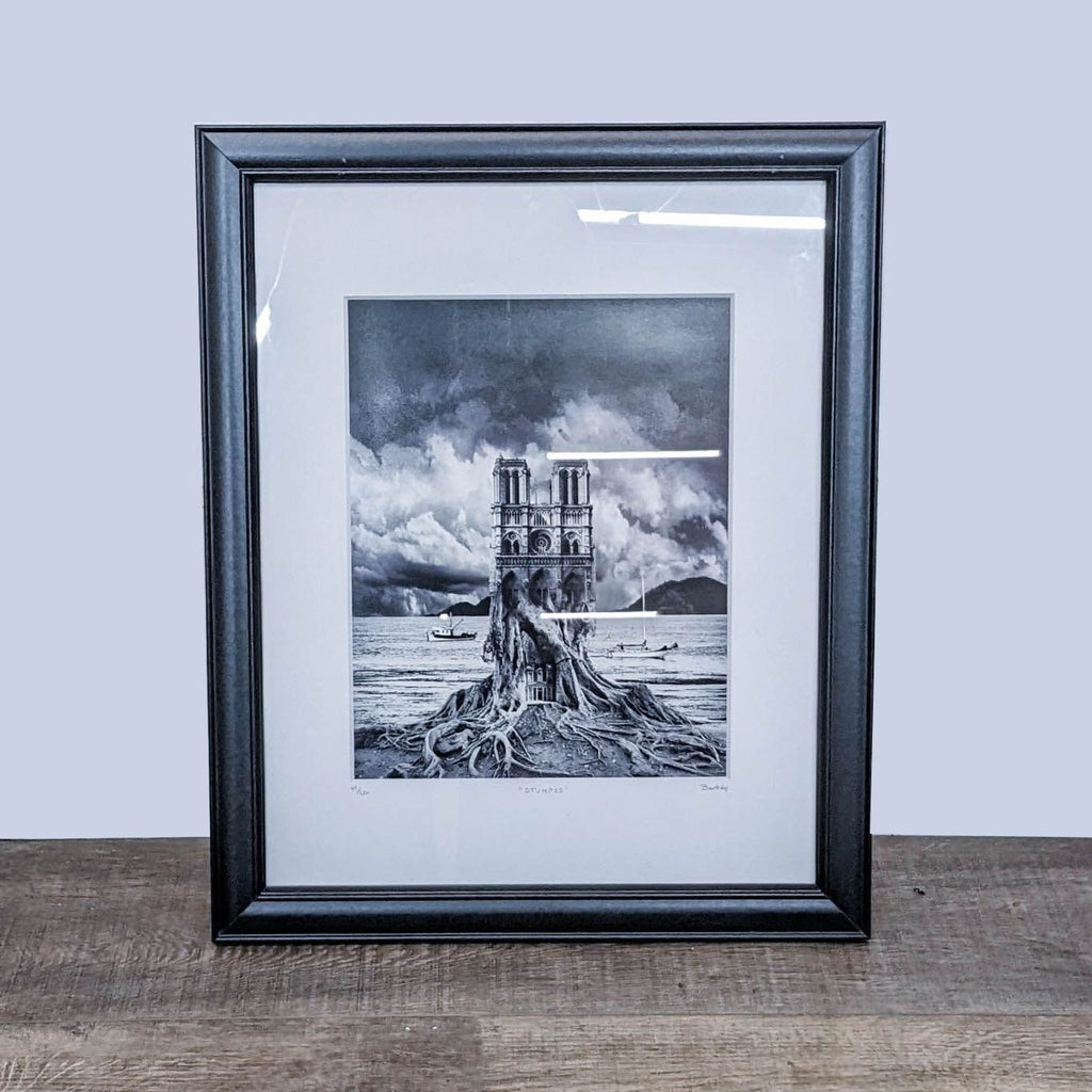 Framed artwork "Stumped" by Thomas Barbey, featuring a tree combined with a cathedral and boats.