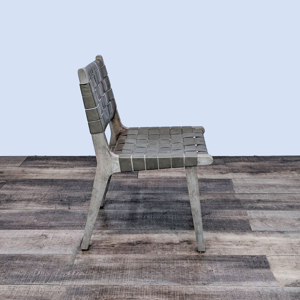 Side view of the Fenton chair, featuring clean lines and mixed materials by Pottery Barn.