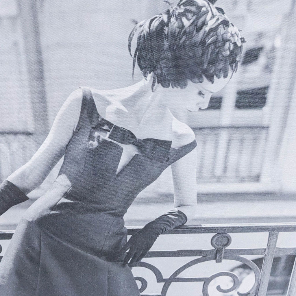 2. Close-up black-and-white canvas print of a woman in a retro gown and feathered hat, 1960s style.