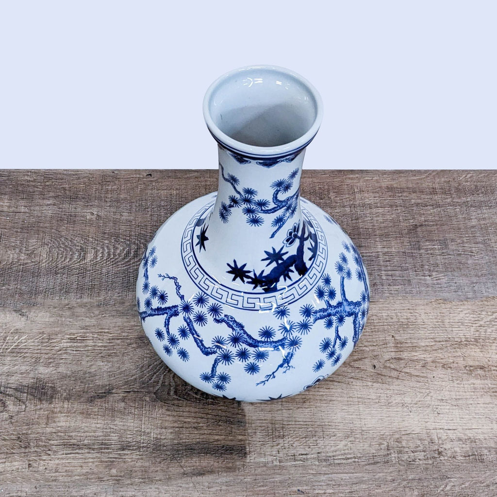 Top view of decorative gourd-shaped vase showcasing detailed blue patterns.