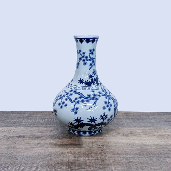Large blue and white gourd-shaped vase with intricate floral design.