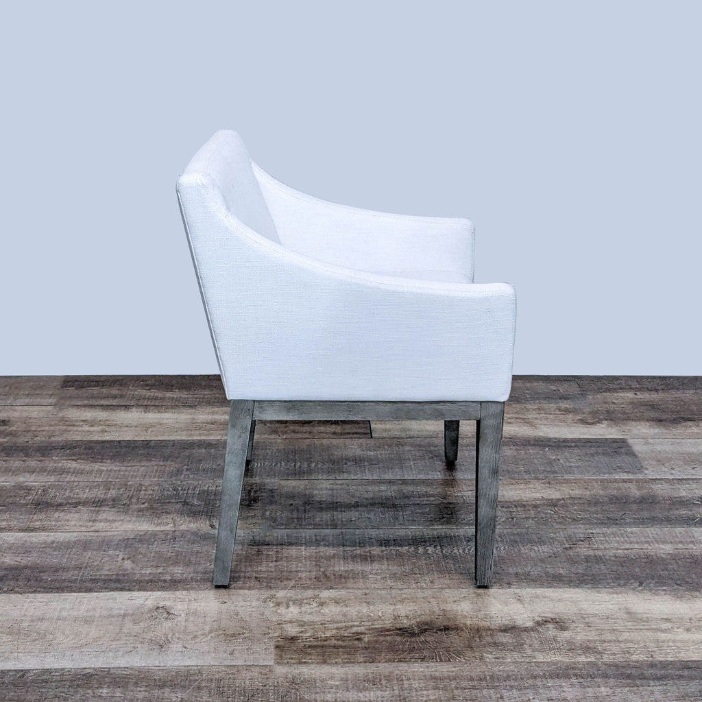 Side view showing the angular silhouette and midcentury design of the wooden-framed Morgan chair.