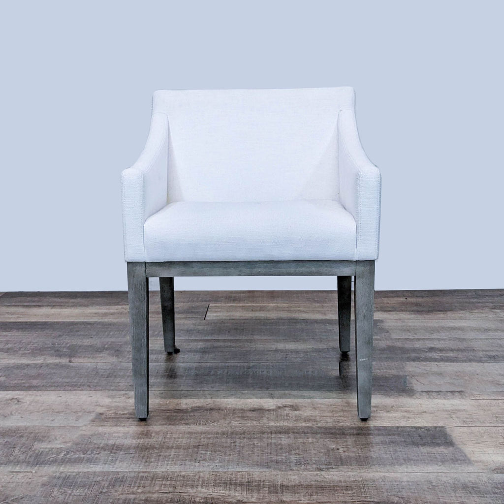 Front view of the Morgan dining chair with tapered legs and plush upholstered seat.