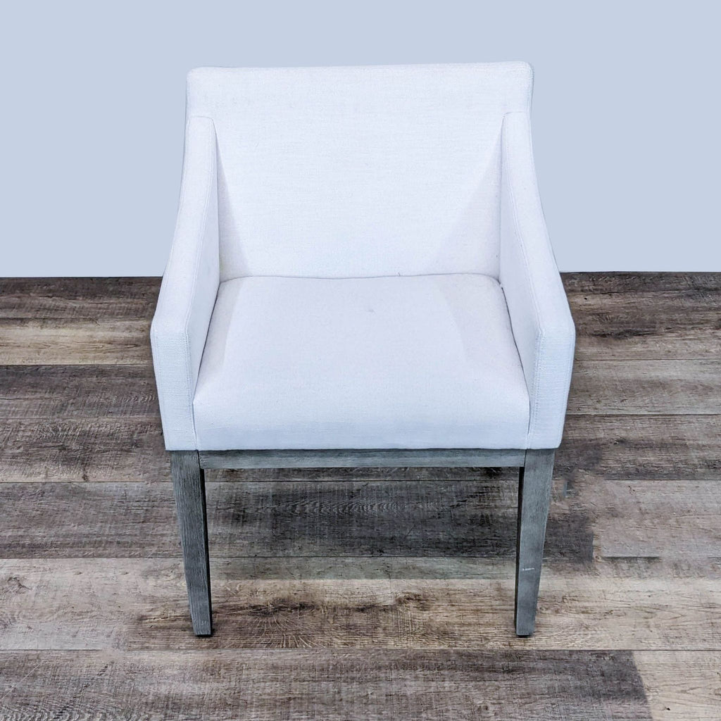 Angled view highlighting the Morgan chair's contrast of wooden frame and upholstered comfort.
